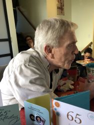 Mike blowning out candles